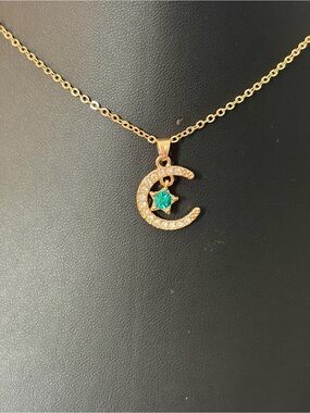 Gold Crescent Moon Necklace with Green Star Accent